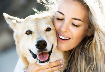 Lady Hugging Dog